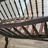 Old wooden rocking cradle twisted / vintage bars