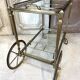 Rolling bar cart in brass and bronze circa 1960
