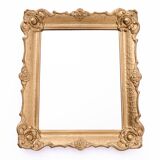 Mirror in a decorative gold frame