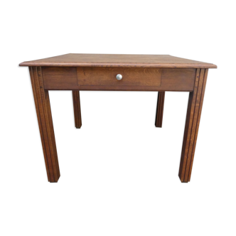 Old square dining table in solid wood