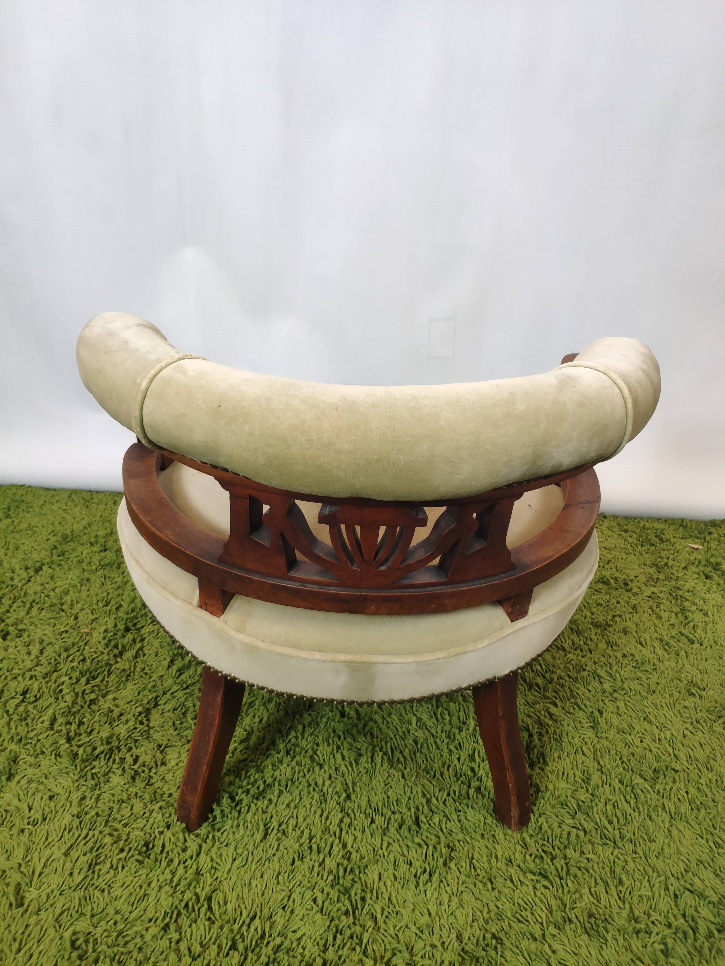 Old green velvet empire chair