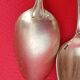 11 Small silver-plated spoons.