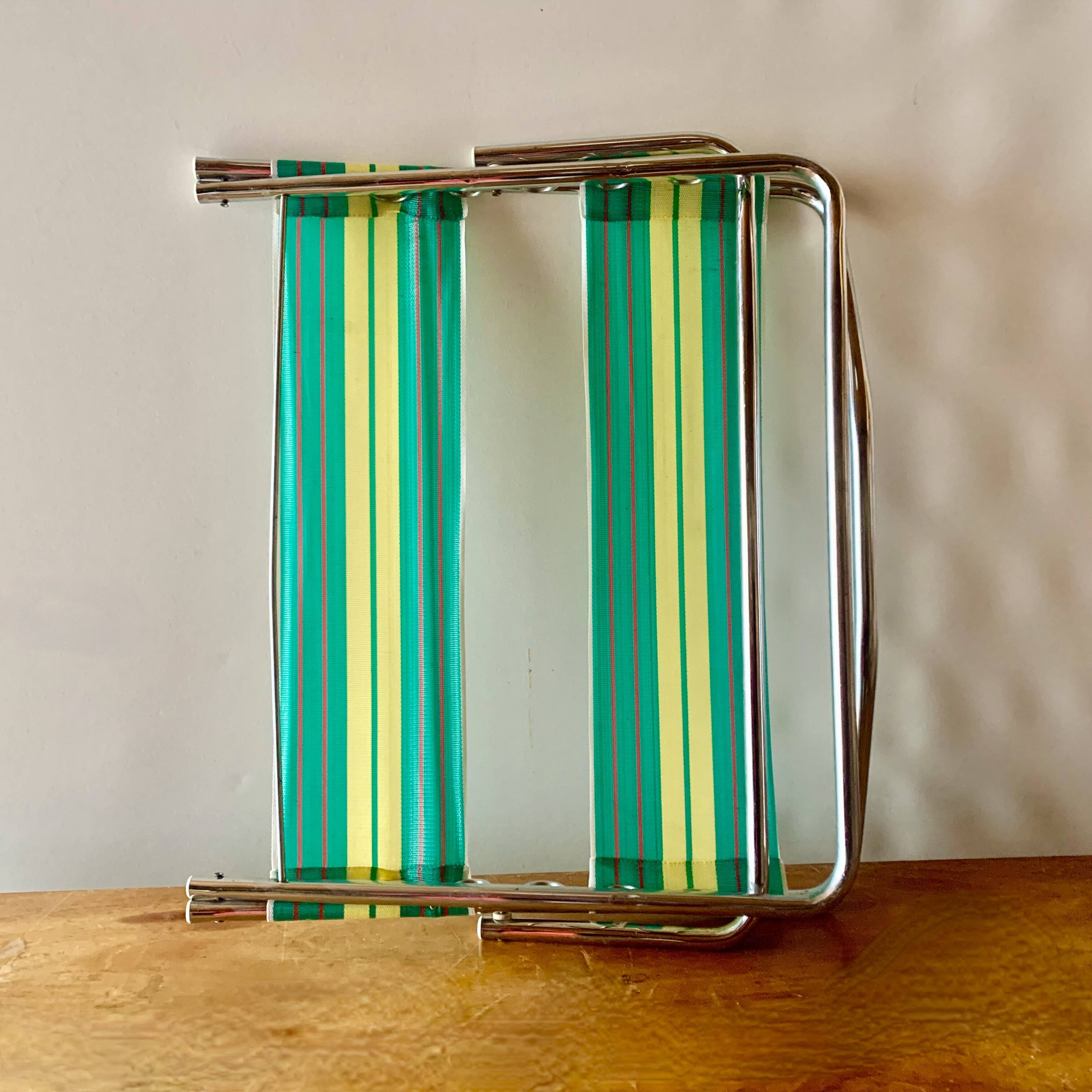 Vintage folding beach chair in chrome metal and woven plastic