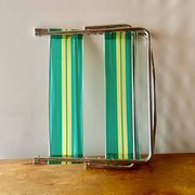 Vintage folding beach chair in chrome metal and woven plastic