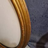 Golden oval frame