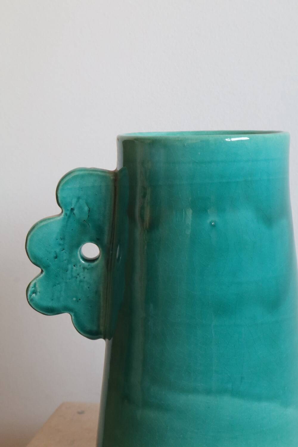 Handmade ceramic abstract vase with large handles and turquoise blue flowers
