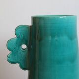 Handmade ceramic abstract vase with large handles and turquoise blue flowers