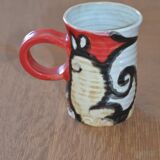 Glazed stoneware mug with snail motif signed
