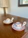 Mismatched duo of Italian ceramic candlesticks