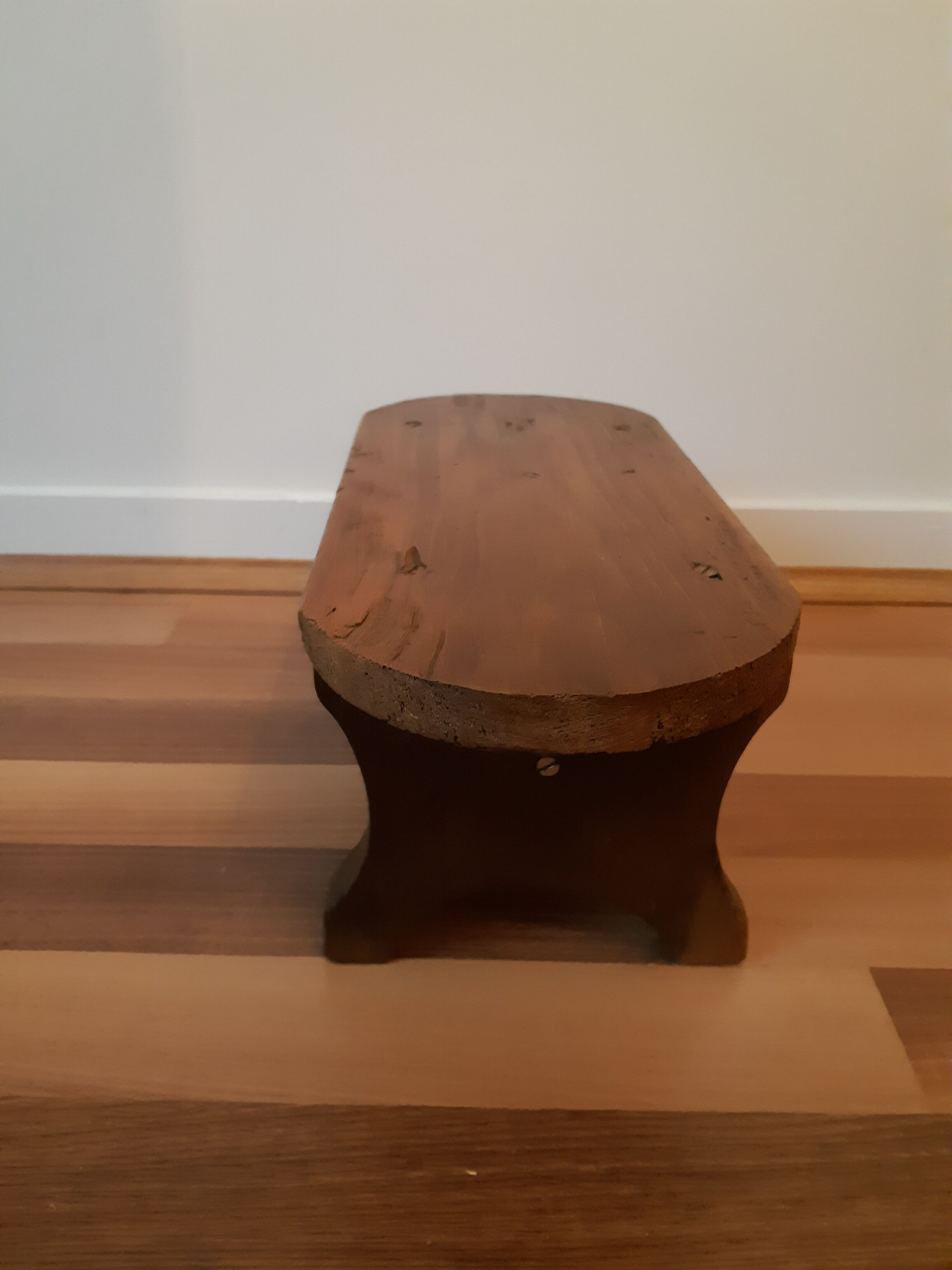 Low milking stool in waxed wood
