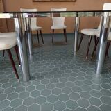 Designer table in glass and metal