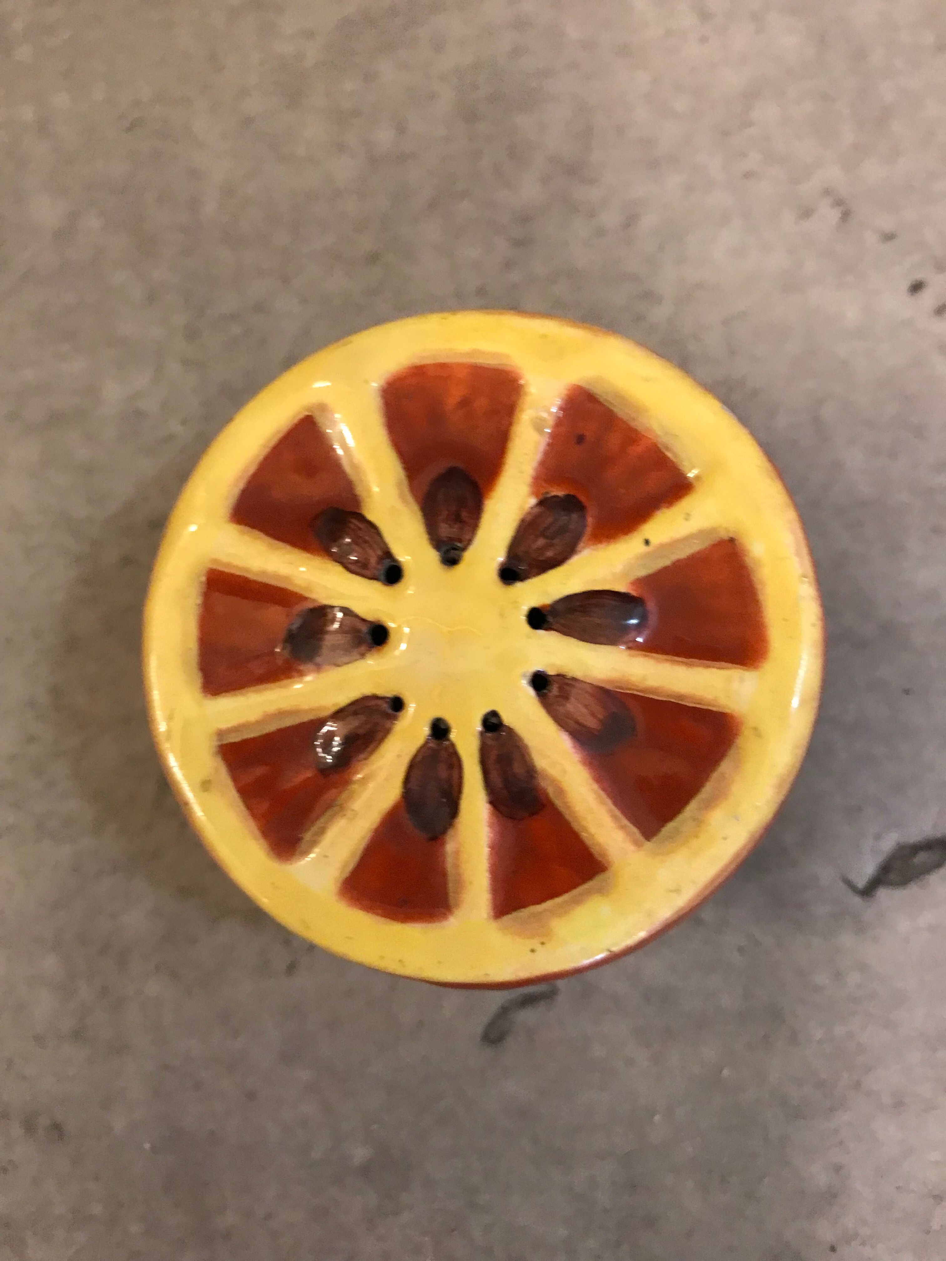 Vintage salt shaker in the shape of an orange marked ermetic