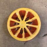 Vintage salt shaker in the shape of an orange marked ermetic