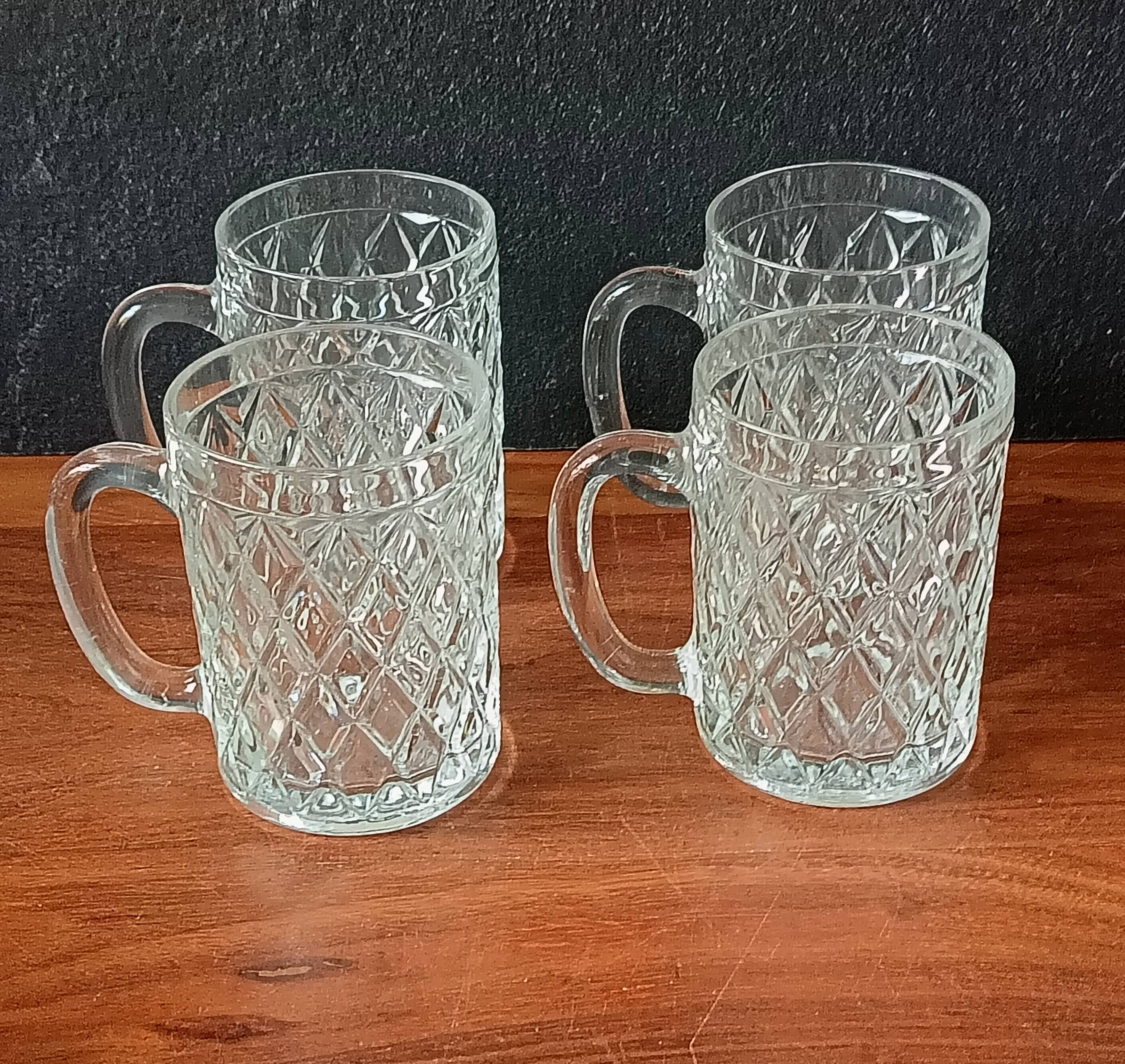 4 vintage beer mugs with a nice design in thick glass, old pint 30 cl.