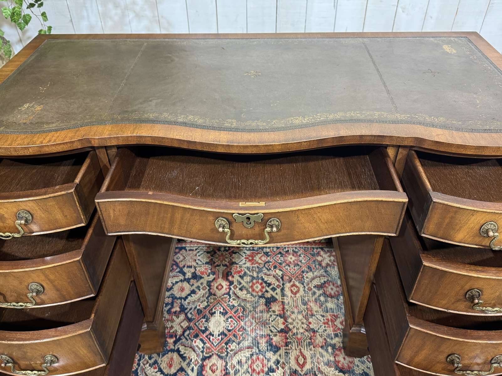 English desk from the 1950s in mahogany with a leather top.