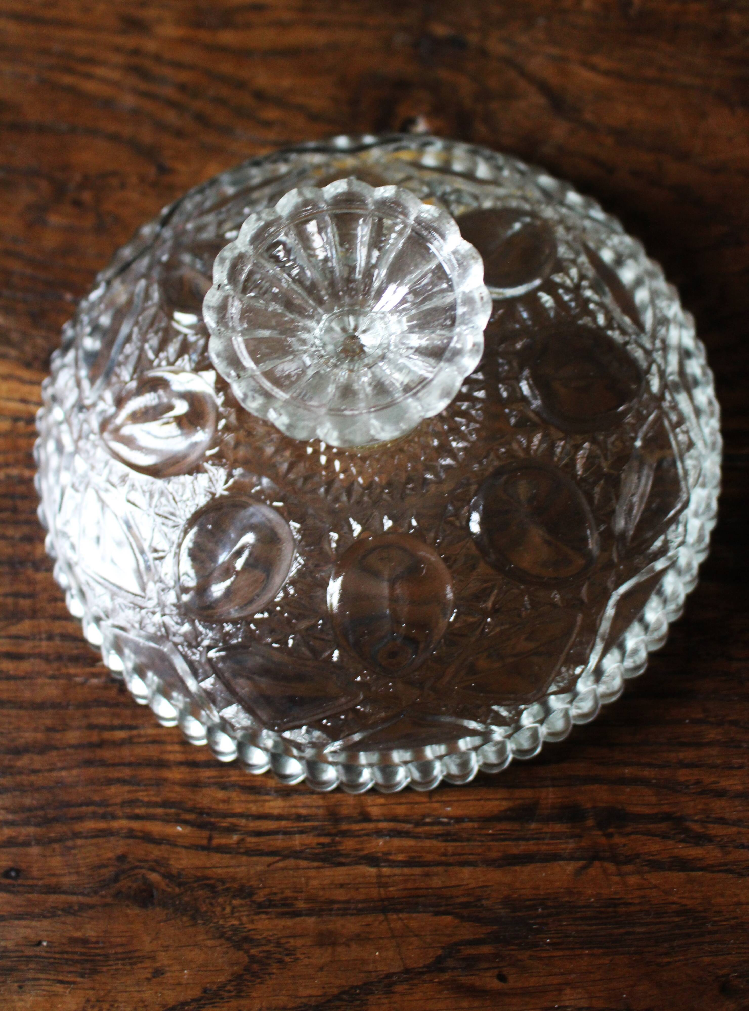 Cut glass goblet with a transparent stem.