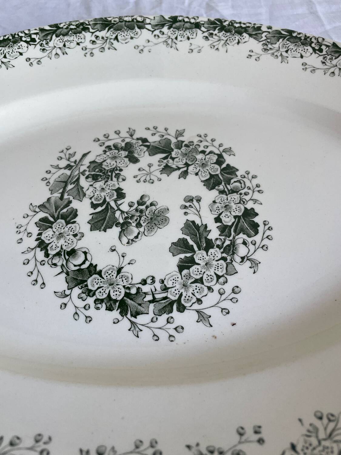 Oval dish with green motorcycles Terre de Fer