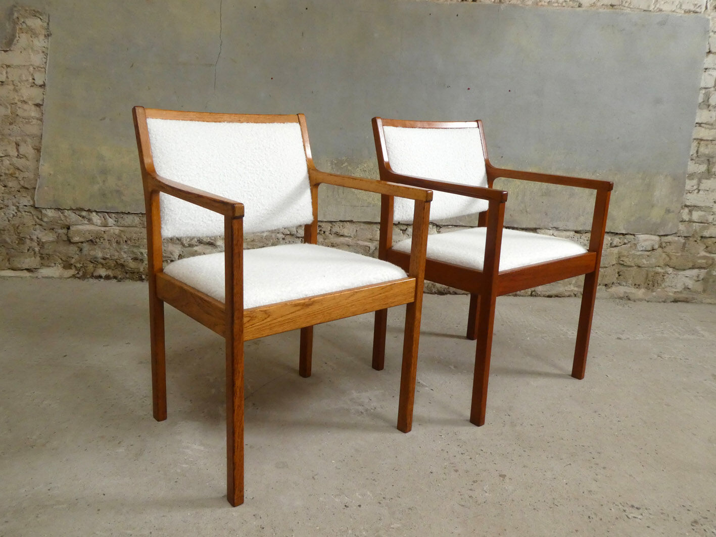 pair of Scandinavian teak armchairs and white buckles