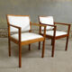 pair of Scandinavian teak armchairs and white buckles