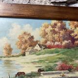 Pair of Art Deco wood and embossed metal landscape frames