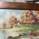 Pair of Art Deco wood and embossed metal landscape frames