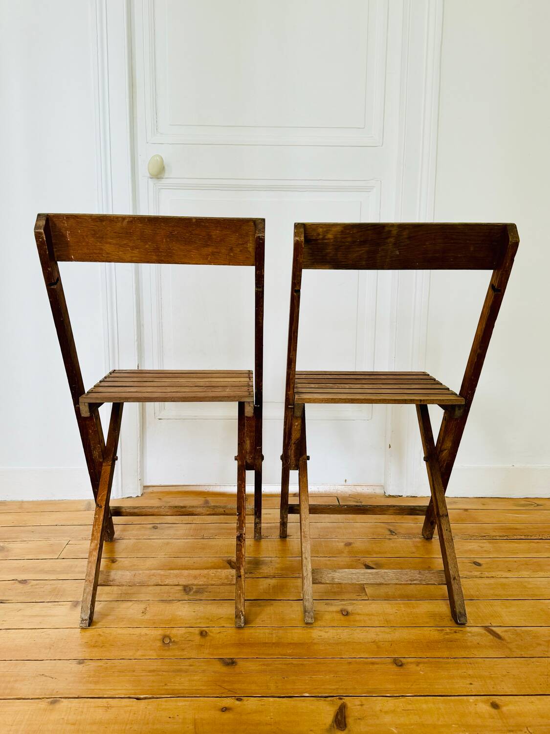 Two vintage wooden folding chairs, circa 1960