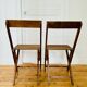 Two vintage wooden folding chairs, circa 1960
