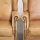 Set of two light cowhide wingback armchairs with a timeless English look