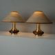 Lot of 2 vintage table lamps from the 1970s, dark wood oval bases with curved brass details, handmade natural fibre lampshades, elegant lighting.