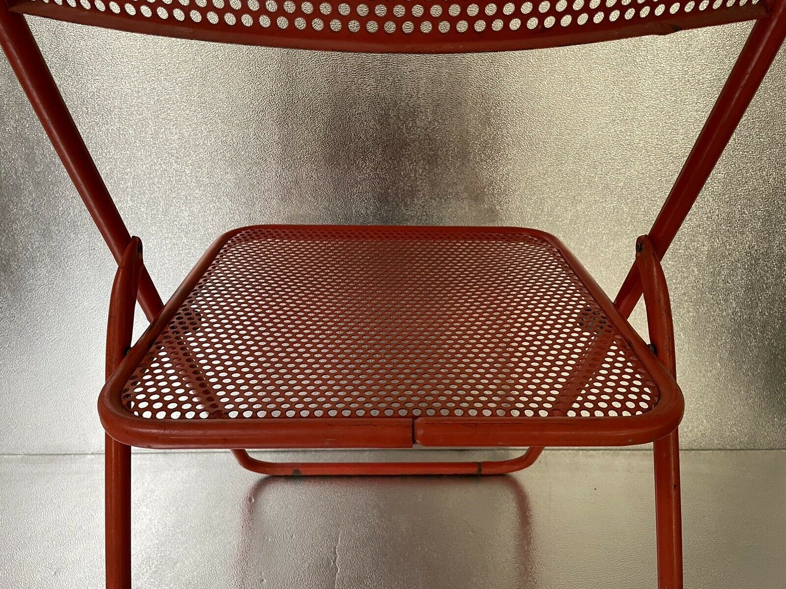 Old folding chair metal perforated red 60s, 70s, vintage
