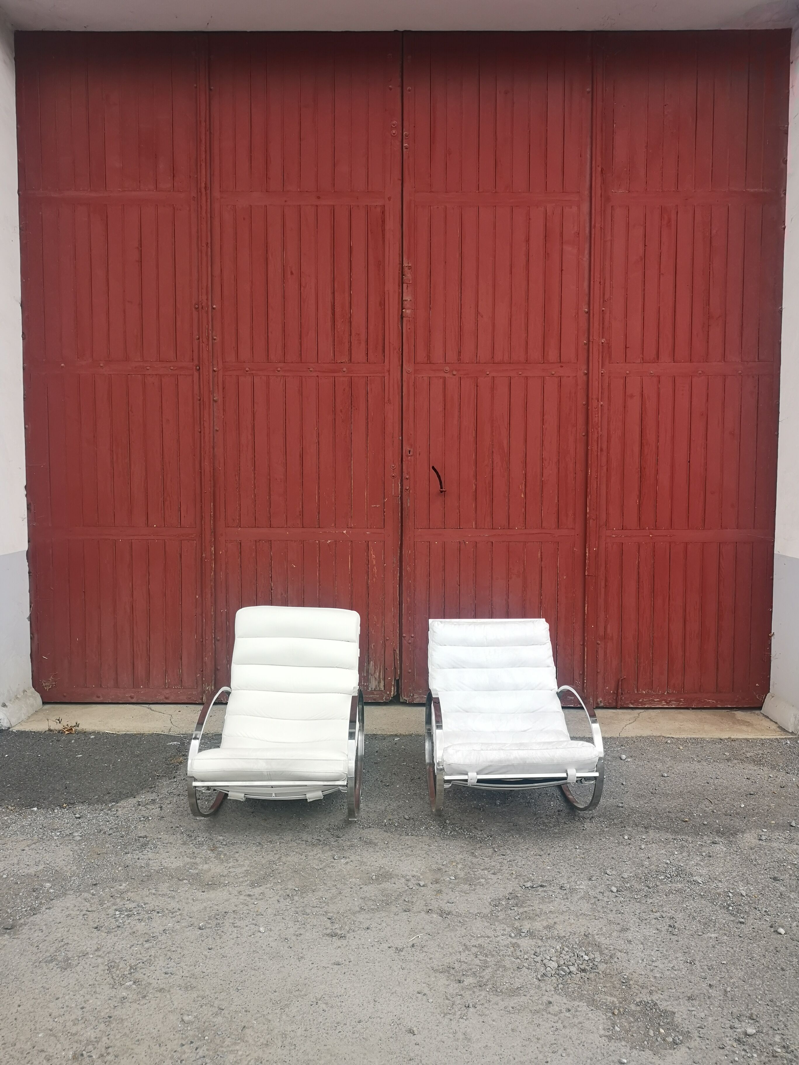 Pair of vintage chrome and leather rocking chairs