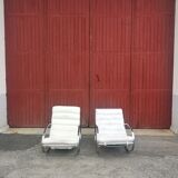 Pair of vintage chrome and leather rocking chairs