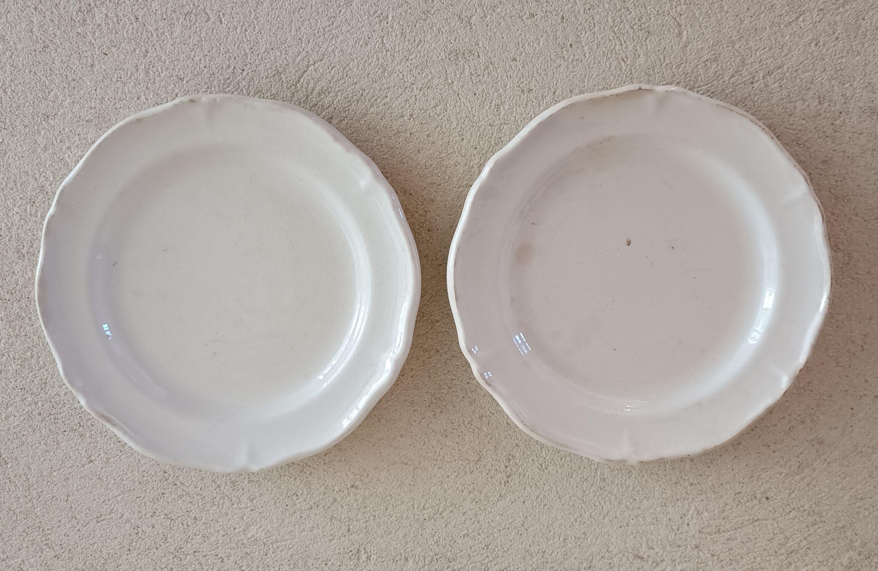 2 ivory plates with godrons