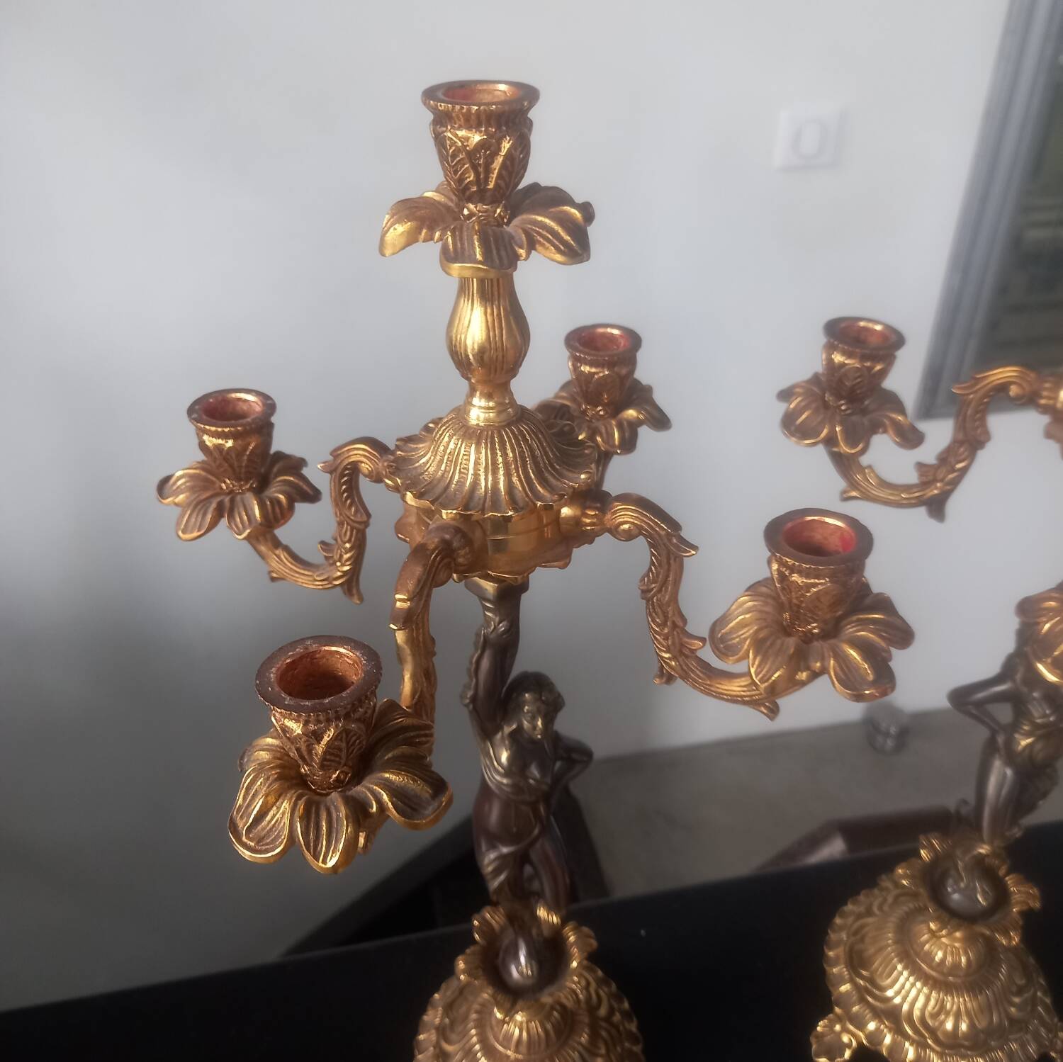 Pair of gilded bronze candlesticks with nude women