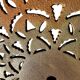 Antique cast iron garden table with decorative openwork top.
