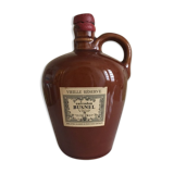 Bottle of Calvados labeled in sandstone