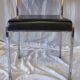 Modernist chair in chromed metal and black imitation leather