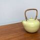 Mid-century ceramic teapot with bamboo handle, 1960s.