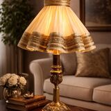 Empire style table lamp with lion heads – gilded bronze and pleated shade