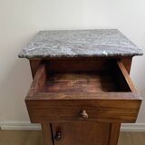 Vintage bedside table in the shape of a wooden column and a gray marble top