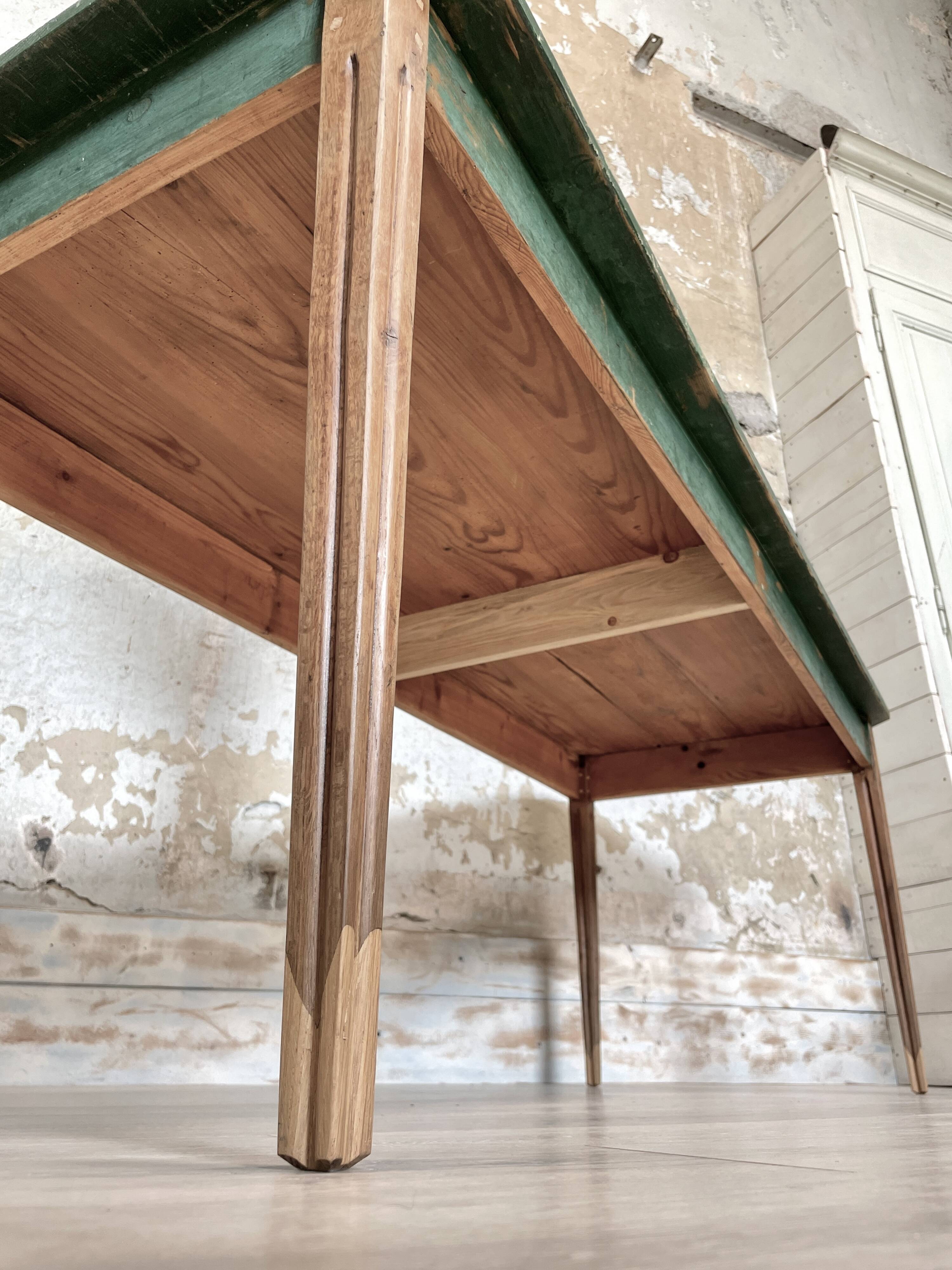 Vintage farm table with spindle legs.