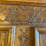 Wedding wardrobe of the Bressan country in walnut and walnut magnifying glass dated 1850