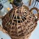 Give me a cylindrical jar with its wicker.