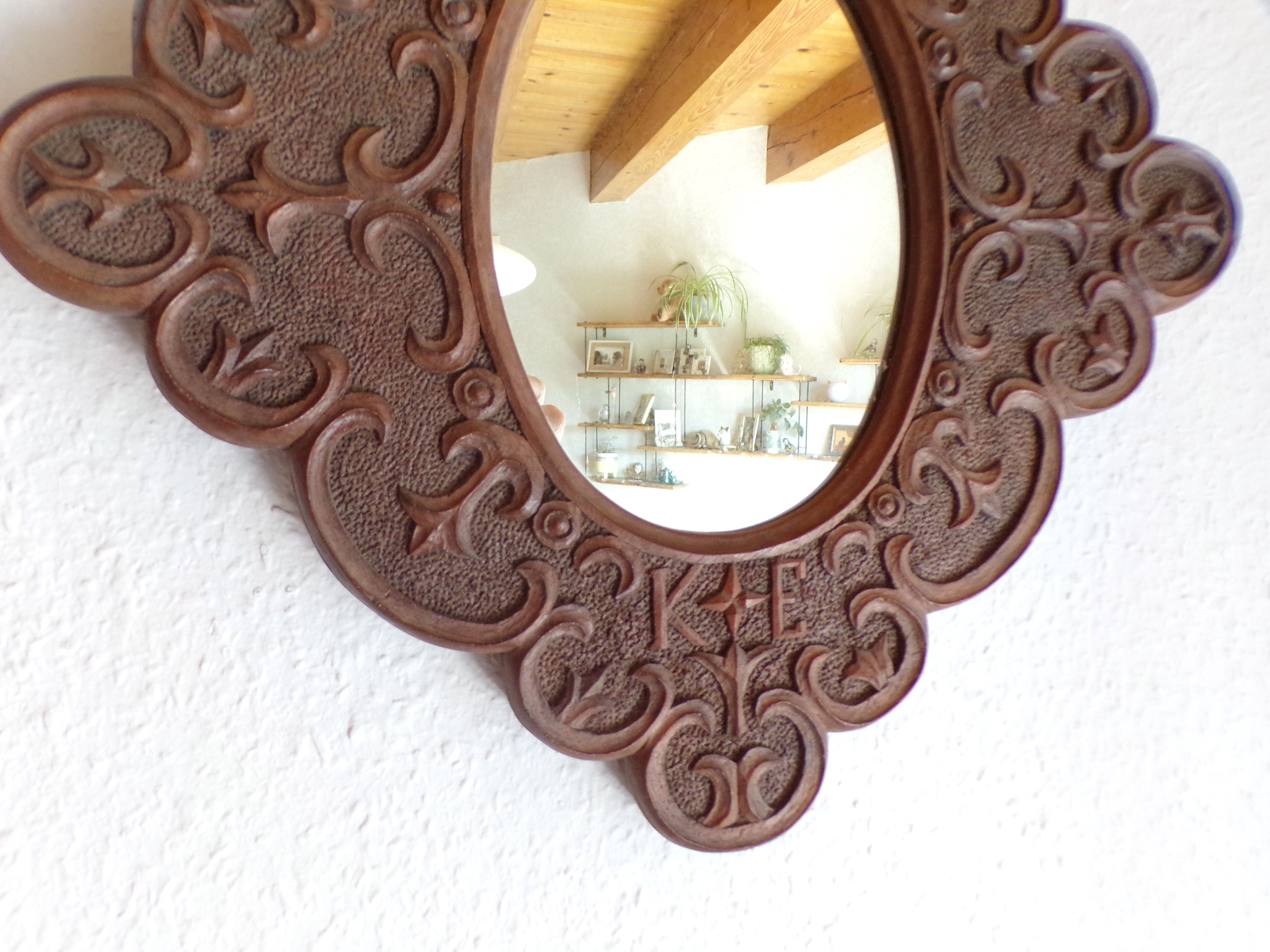Carved wooden mirror and dated 1924