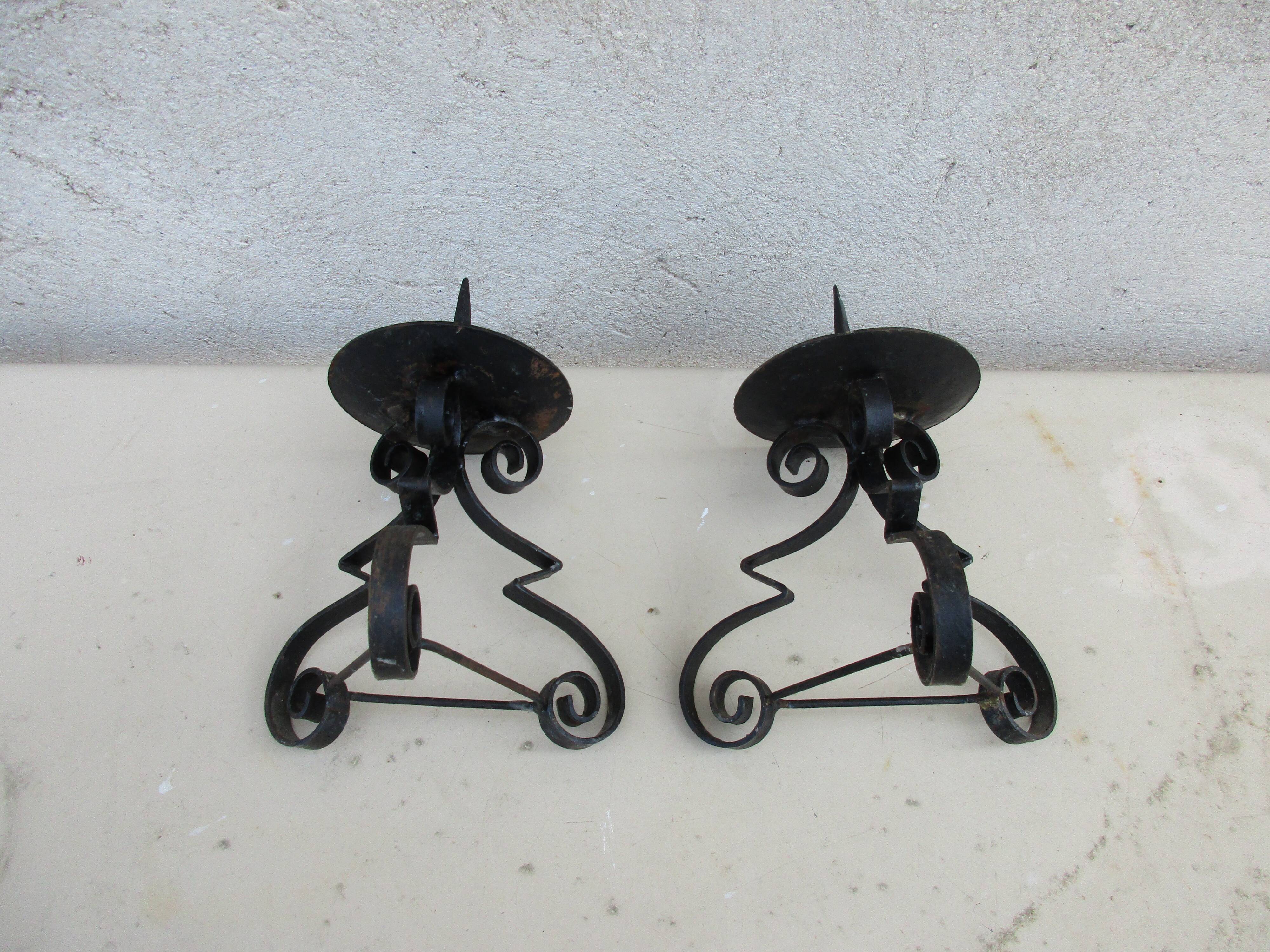 Pair of iron candlesticks