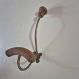 Vintage 1960s wall coat rack in wood and metal.