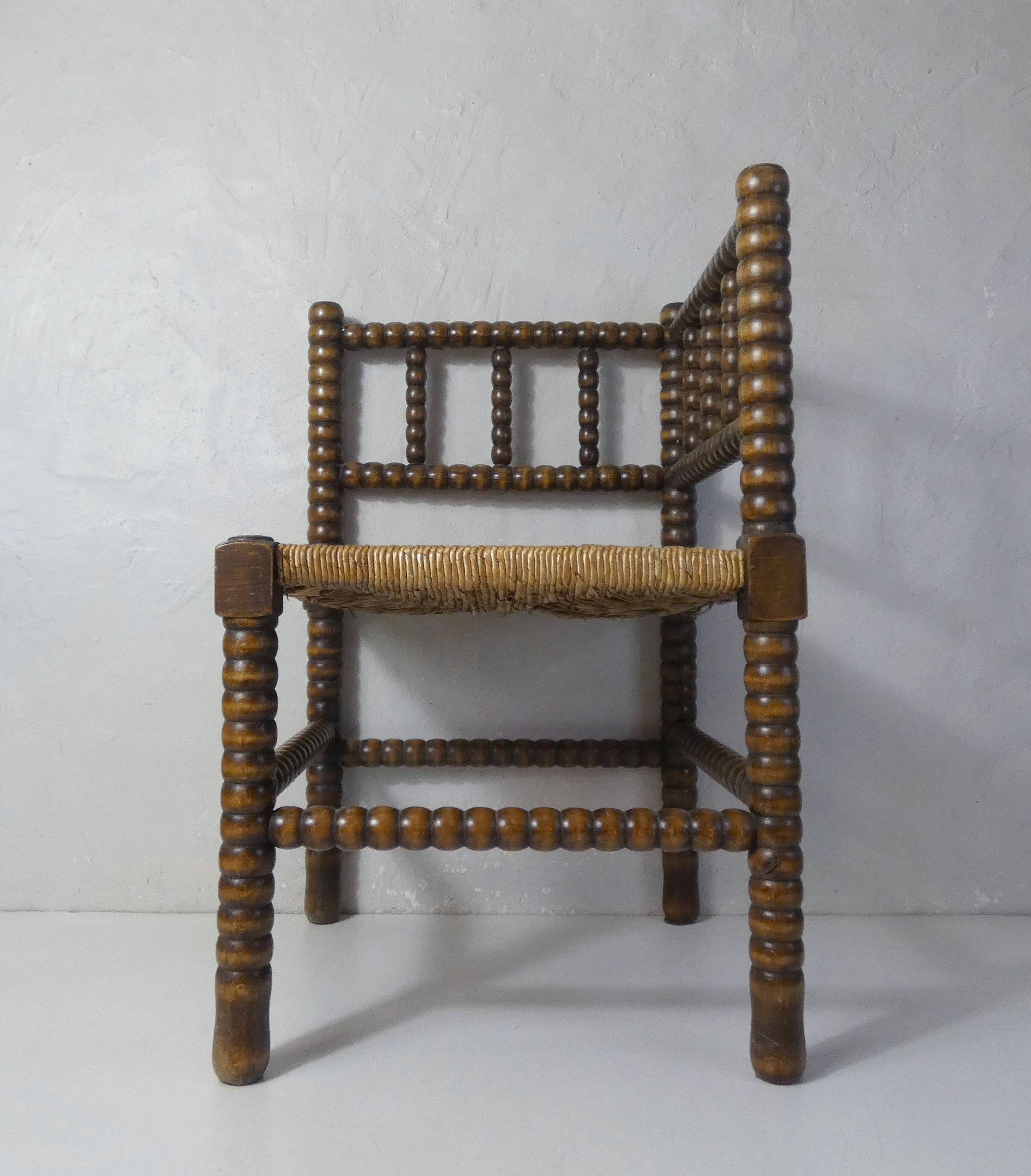 Old corner armchair beaded wood paillé