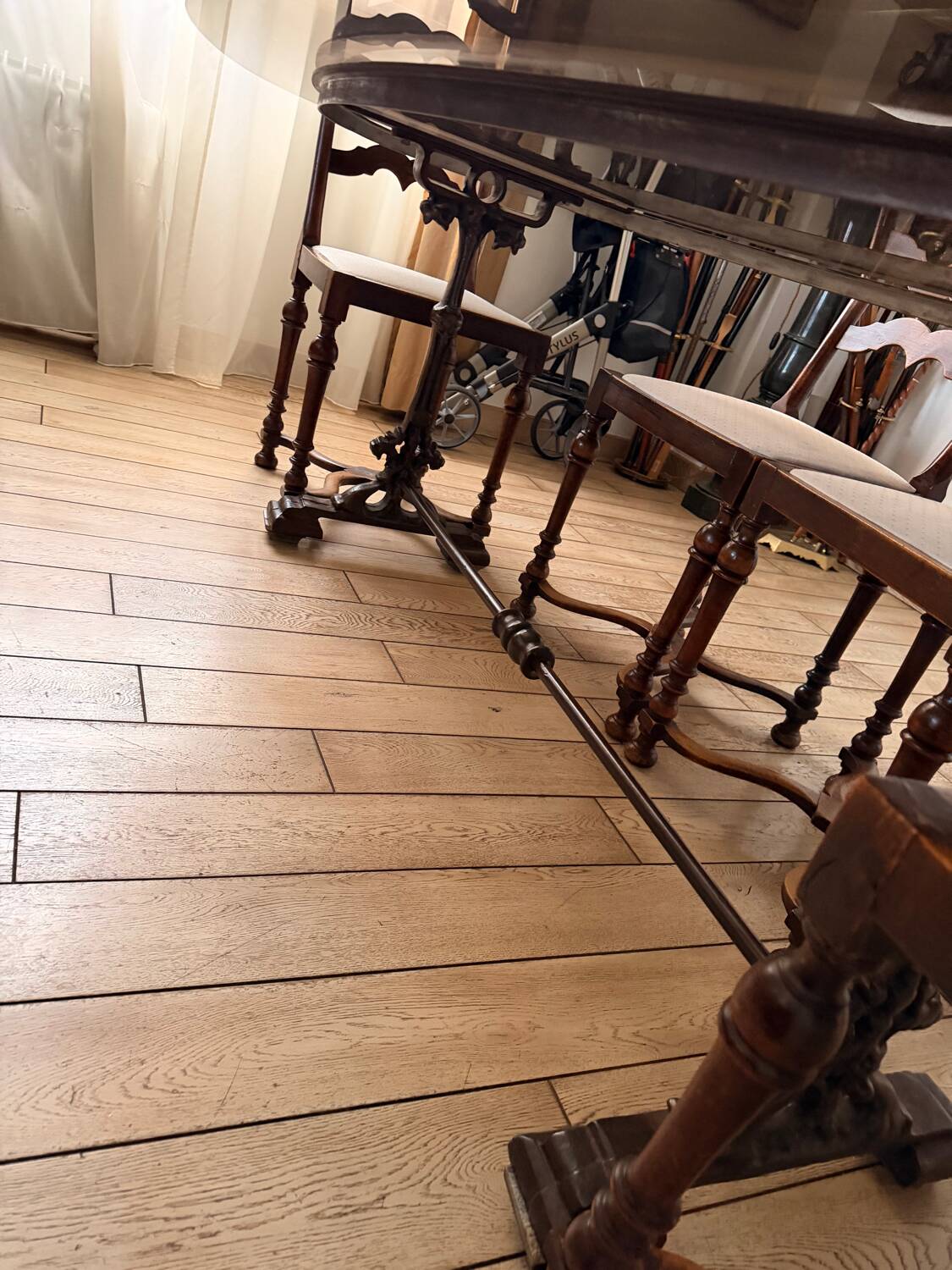 Large antique dining table in wrought iron and smoked glass,