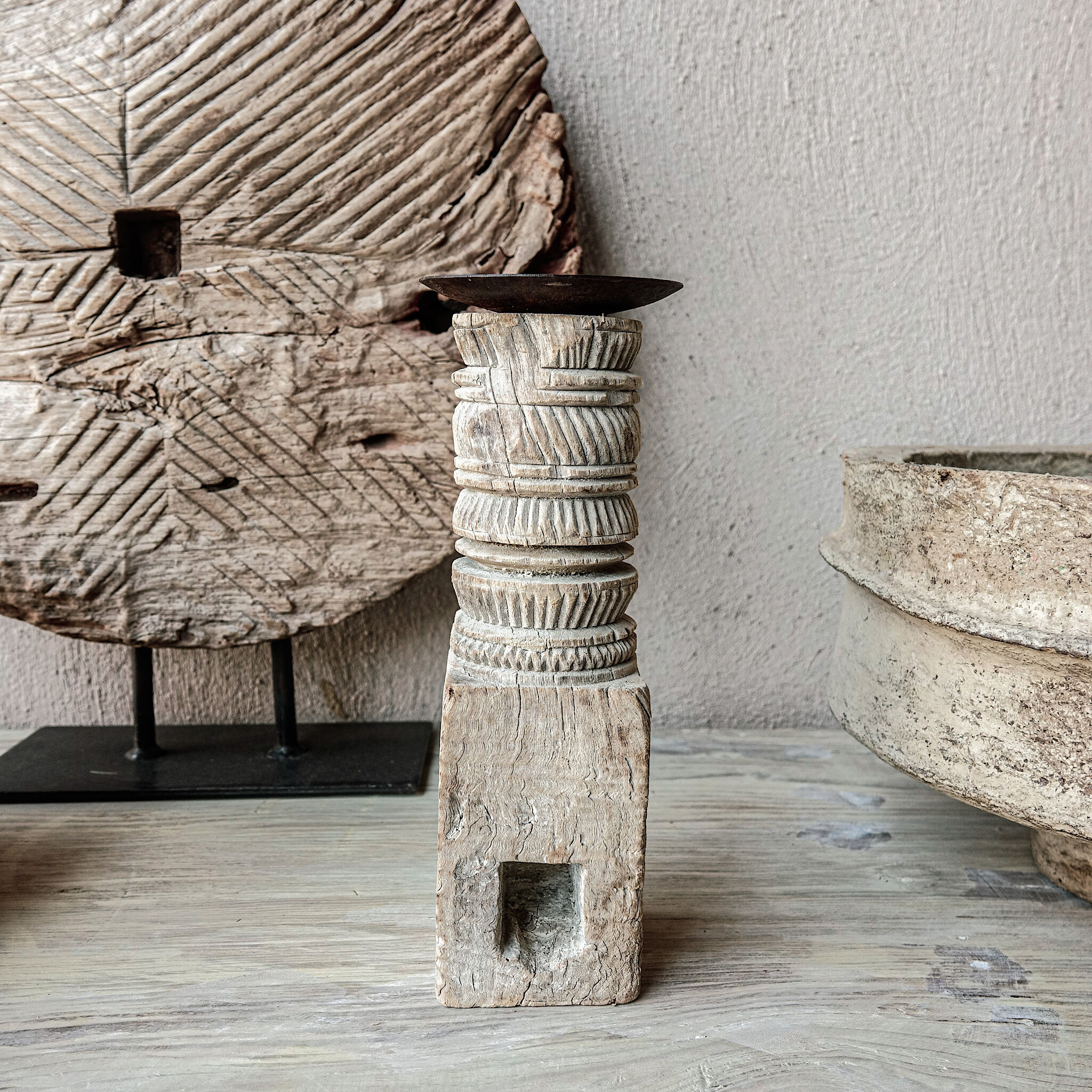 Candle holder in light carved wood