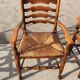 Set of 4 rustic vintage armchairs in English farmhouse style with rush seats.